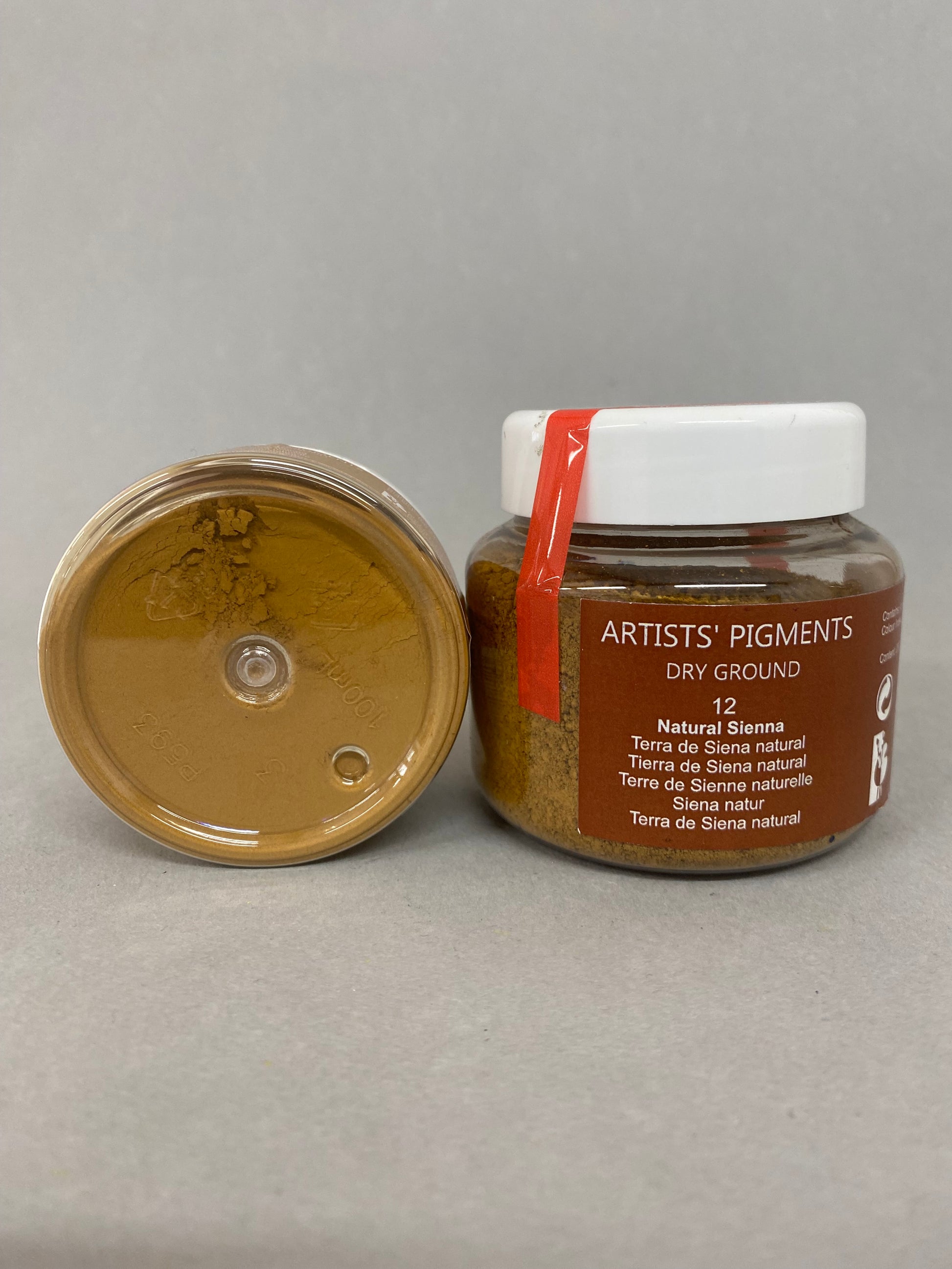 Jar of Artists' Pigments on a gray background