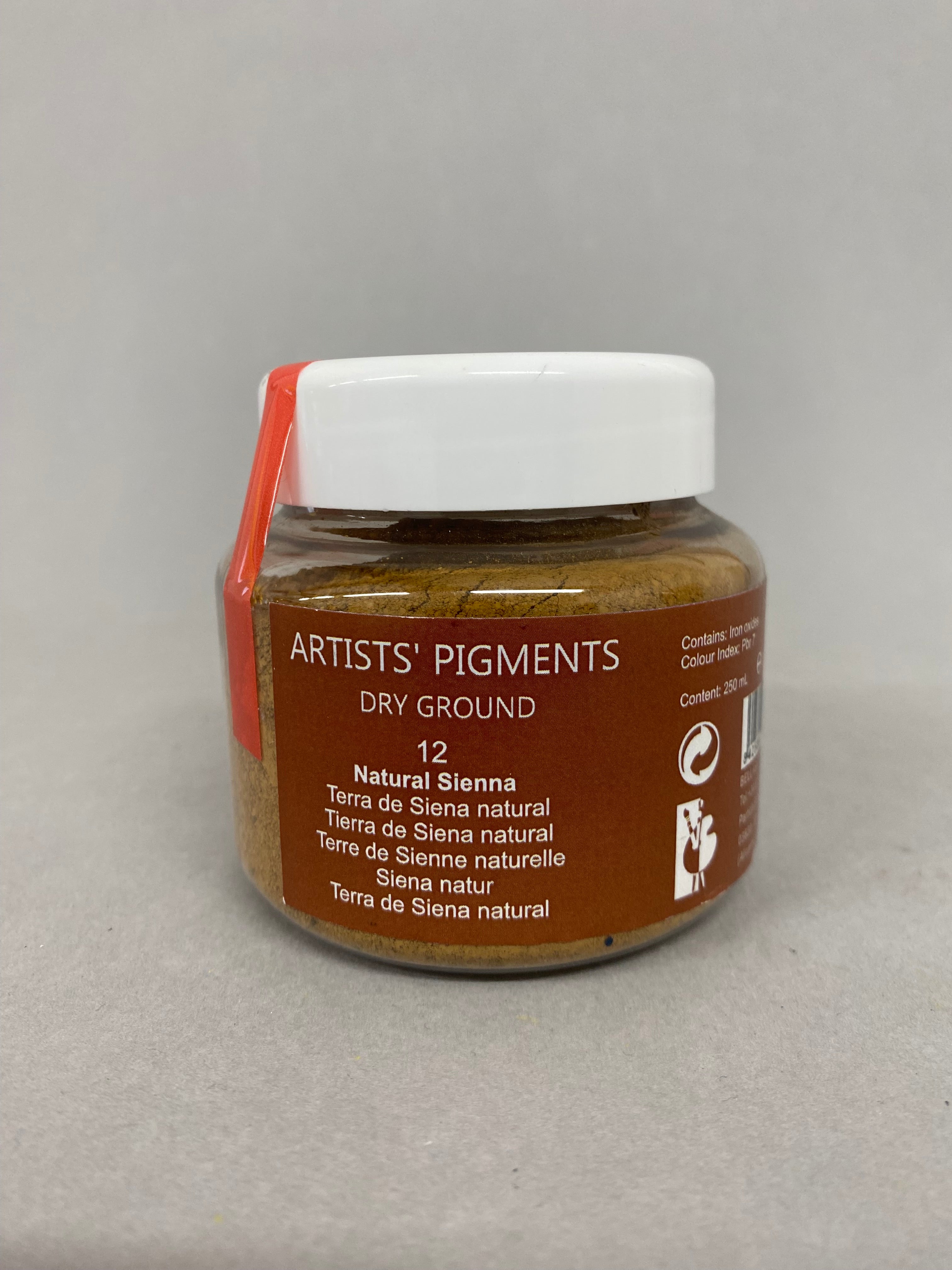 Jar of 'Artists' Pigments' dry pigment on a gray background