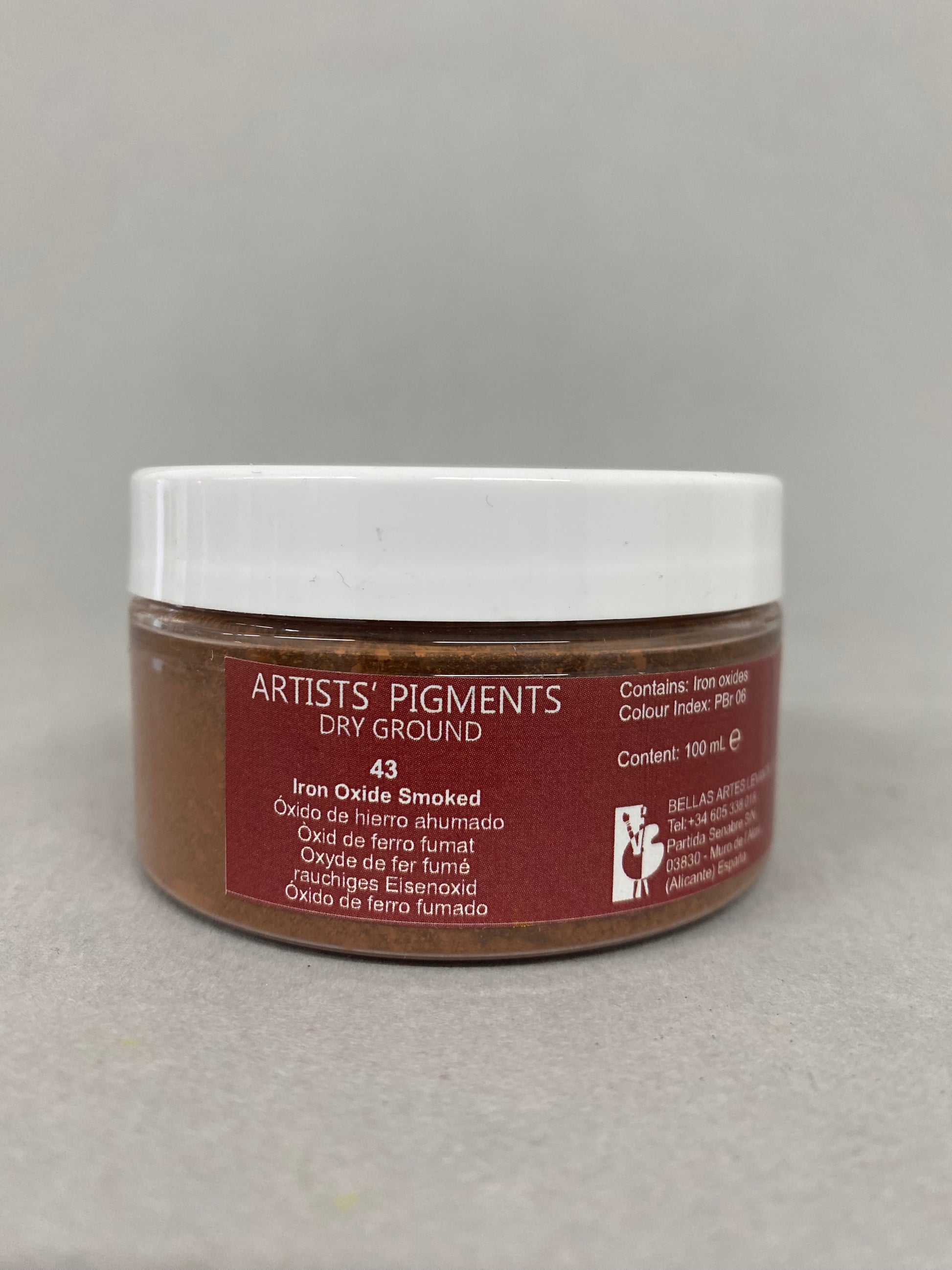 Jar of Artists Pigments dry ground on a gray background