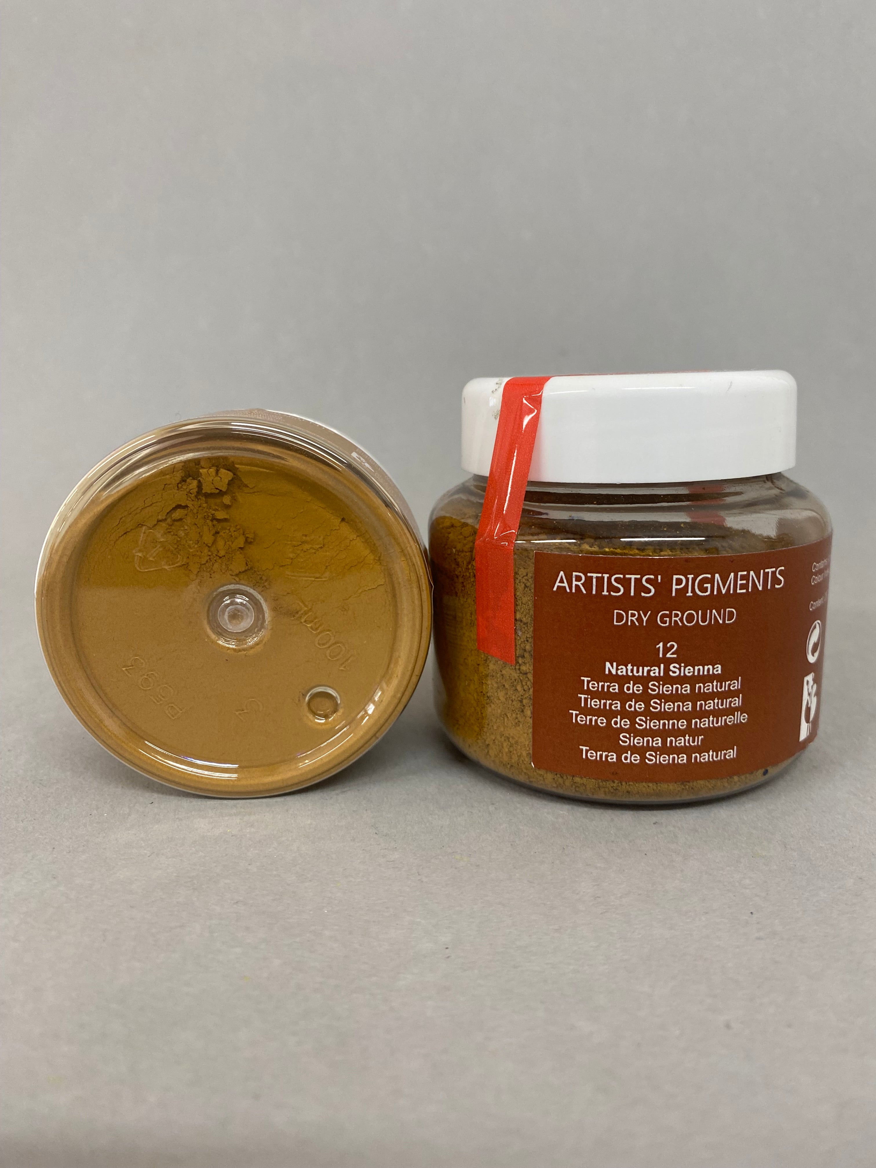 Jar of Artists' Pigments on a gray background