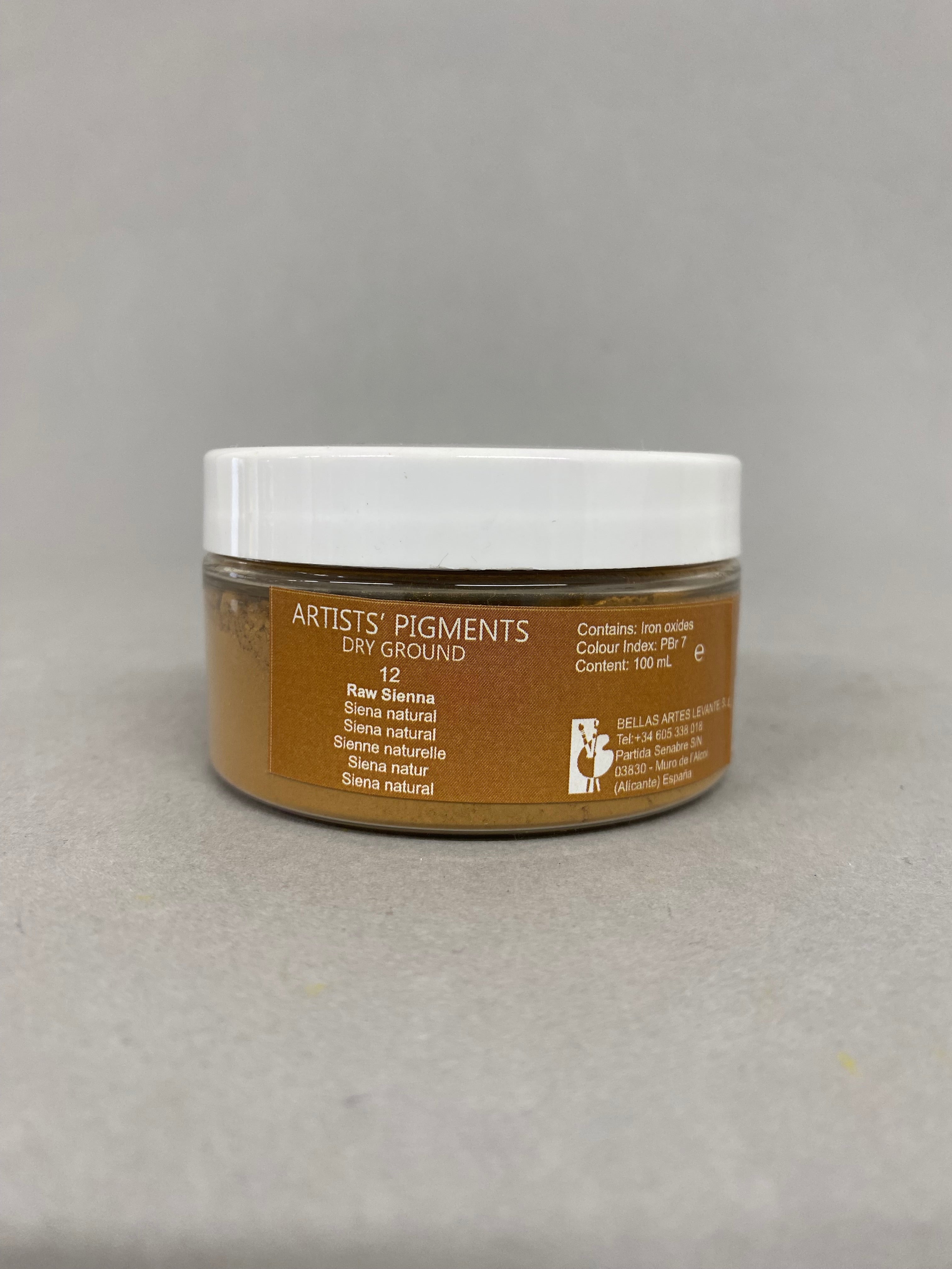 Jar of 'Artists Pigments' on a gray background