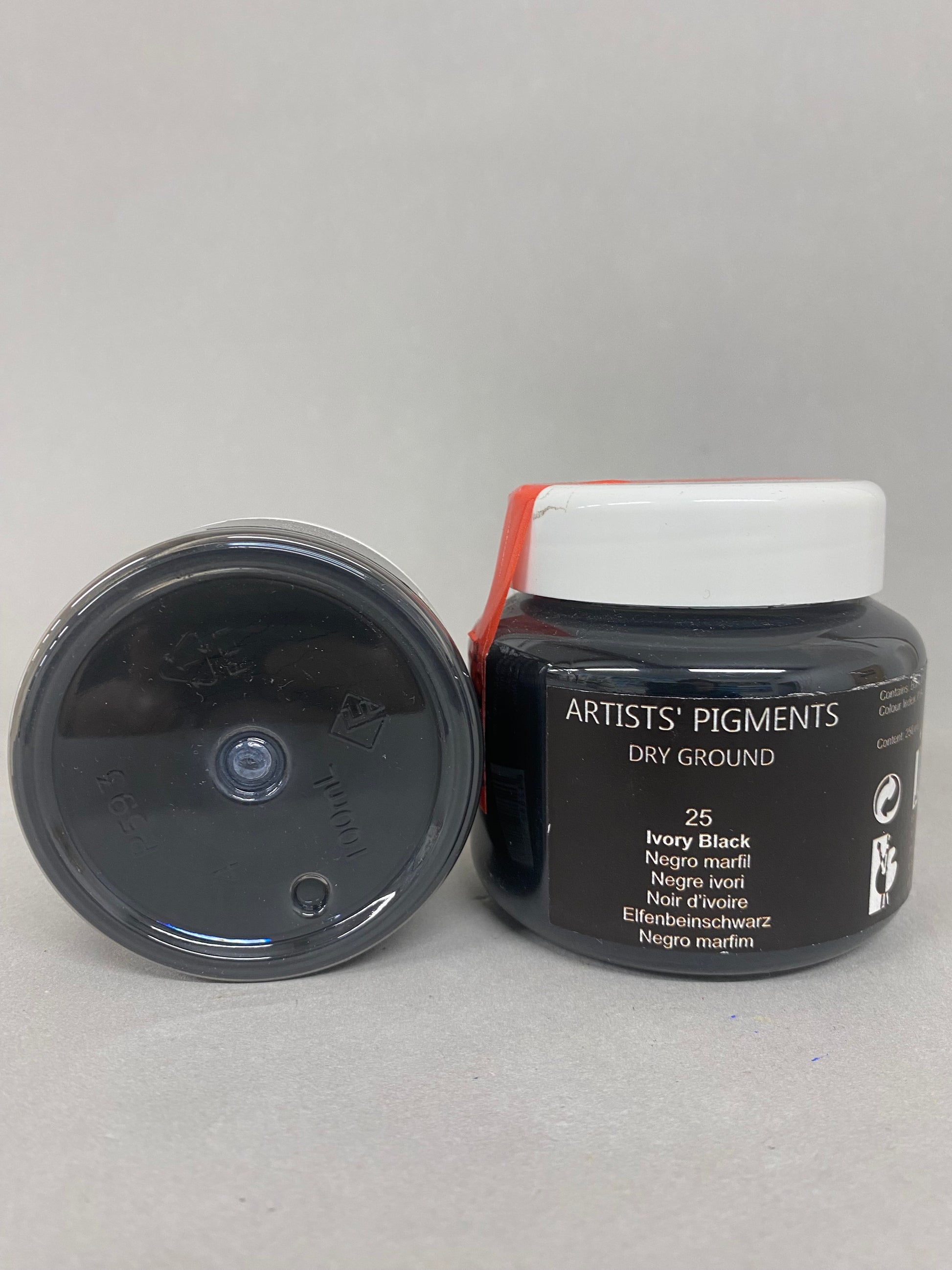 Artists' Pigments dry ground container on a gray background