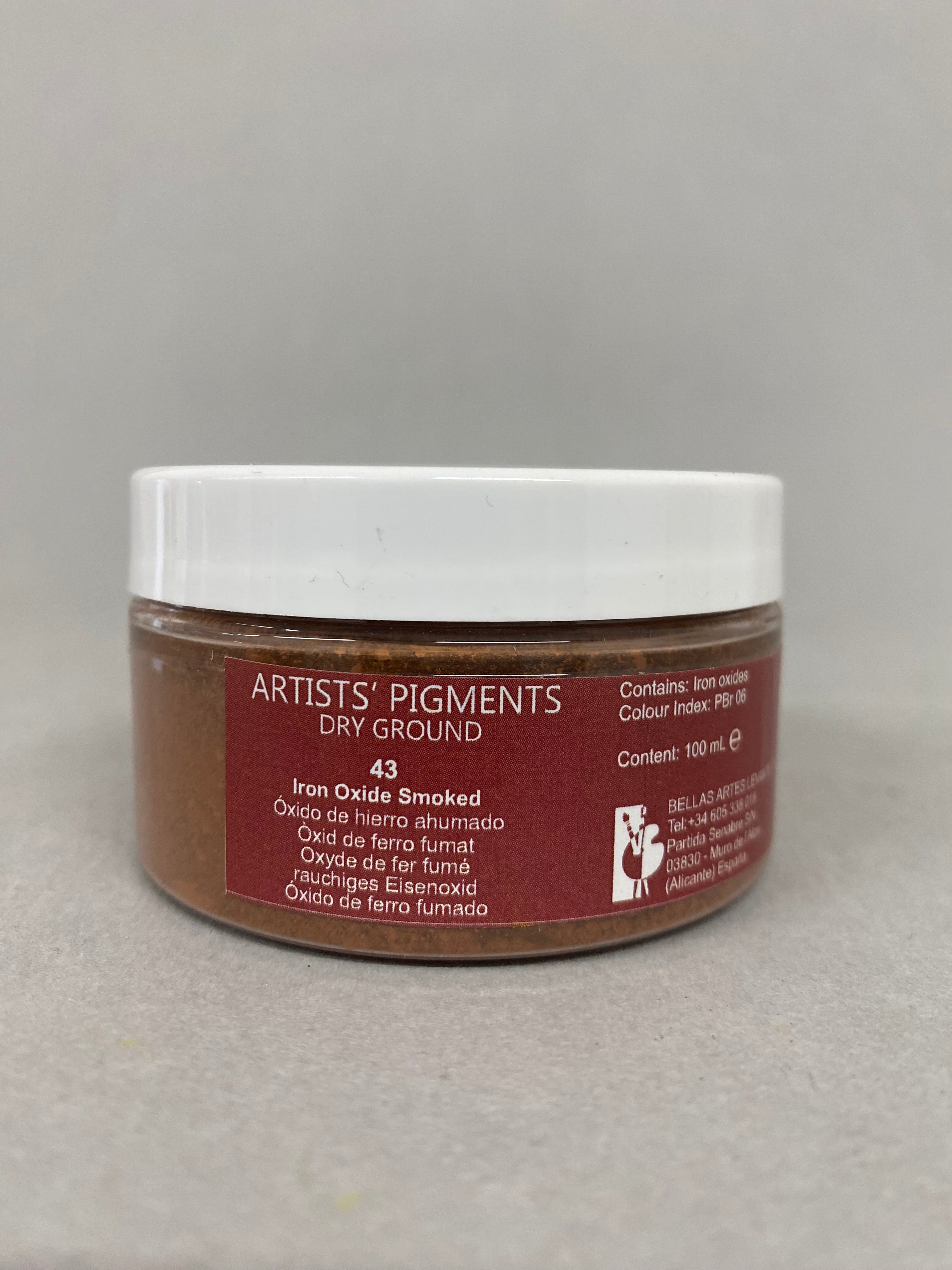 Jar of Artists Pigments dry ground on a gray background