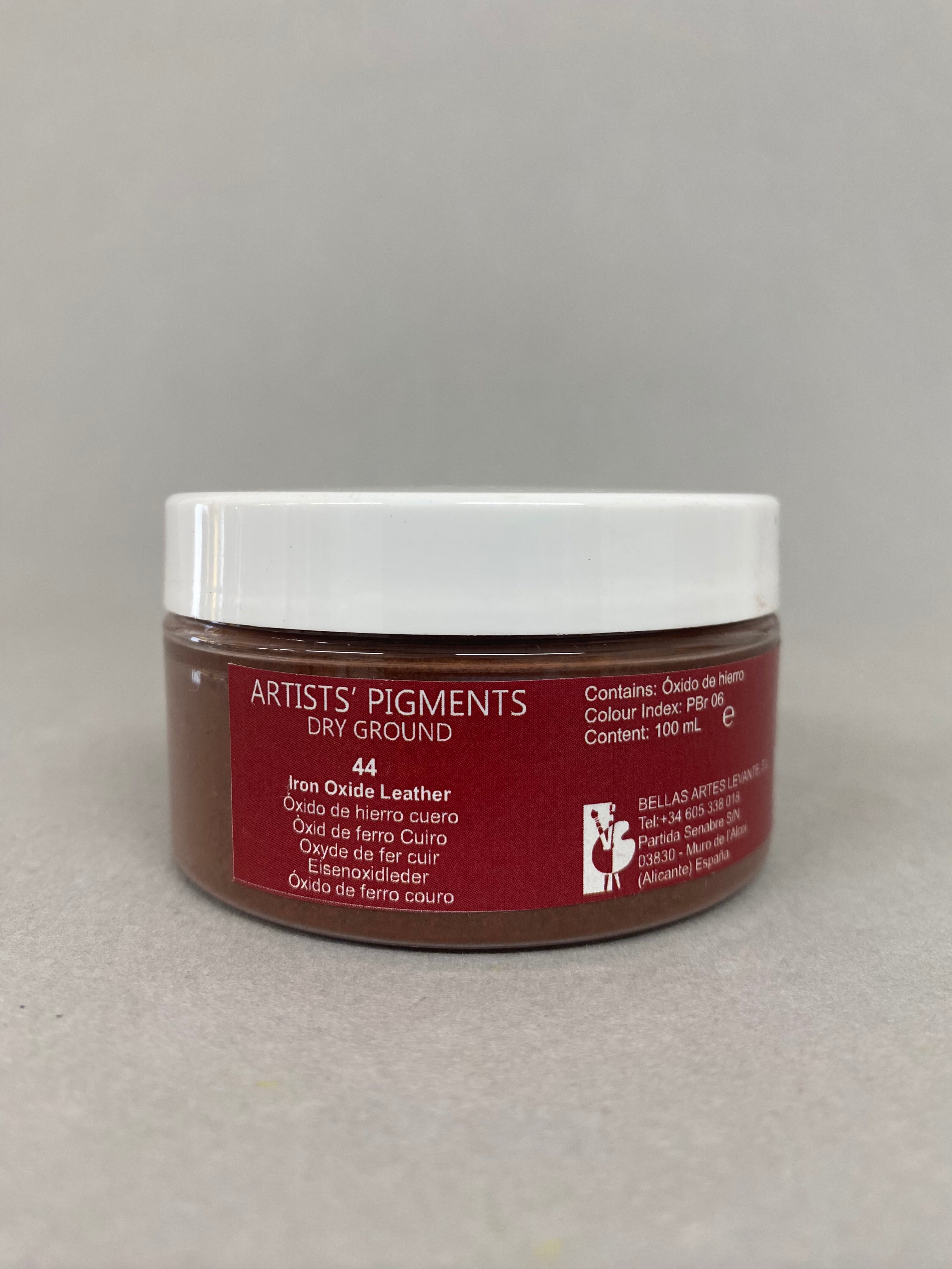 Jar of 'Artists Pigments' dry ground on a gray background