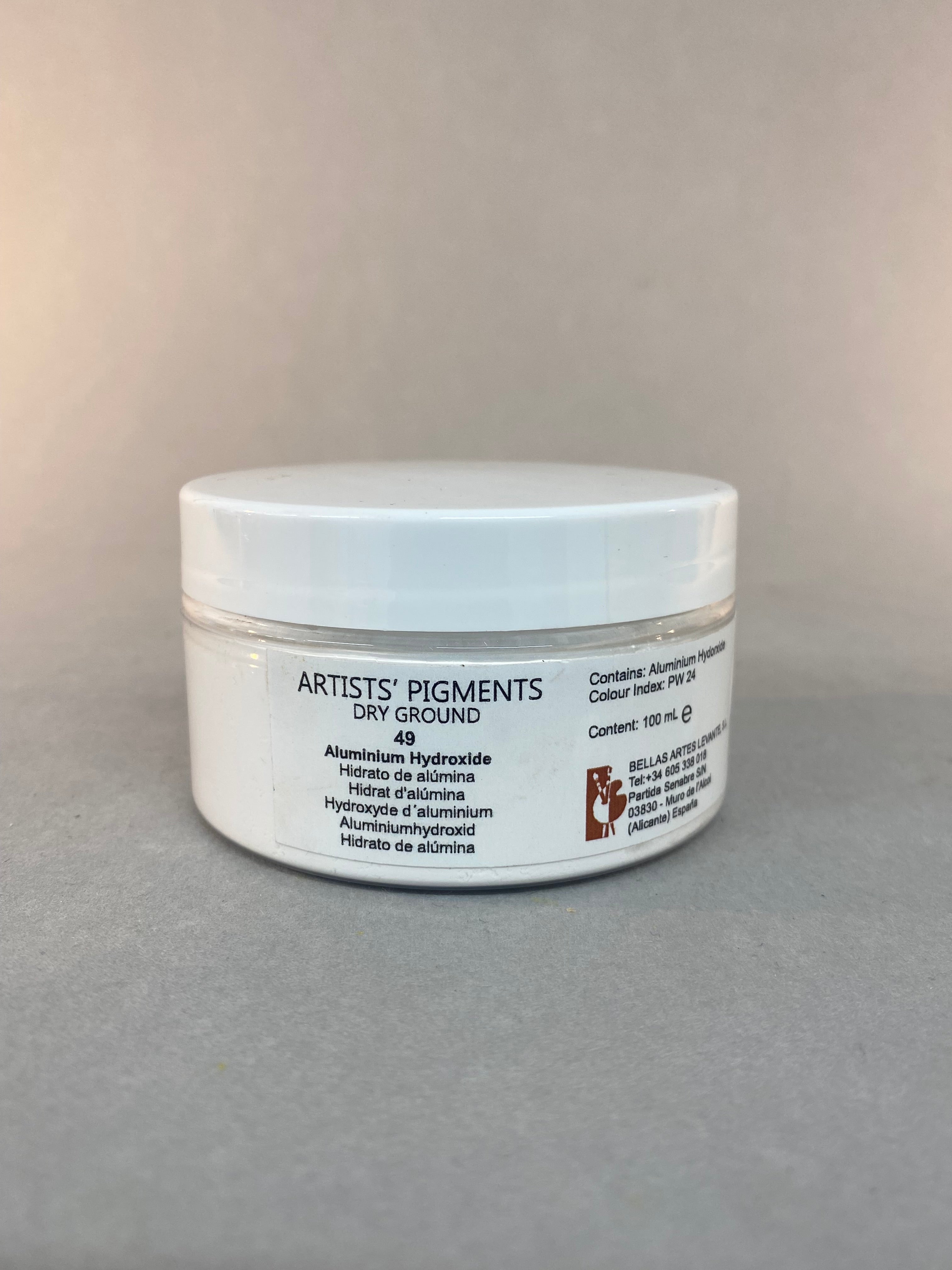 Small white container with a label on a gray background